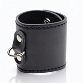 Black leather-style 2-inch ball stretcher cuff with silver D-ring attachment and smooth stitched finish