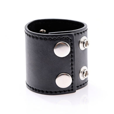 Side angle view of black 2-inch ball stretcher featuring dual snap closure and metal D-ring hardware
