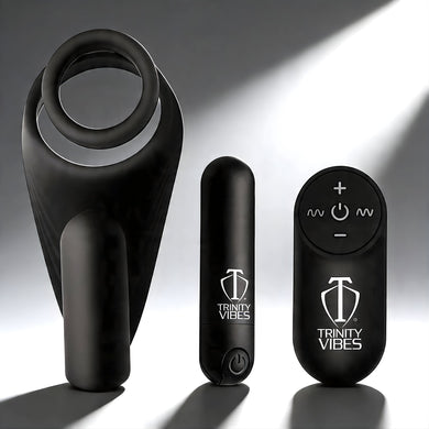 Black silicone c-ring with vibrating taint stimulator shown with bullet vibrator and remote control for hands-free stimulation