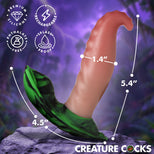 A novelty erect penis-shaped toy with a flesh-toned shaft and a green flared base, shown on a purple fantasy-style background with measurement lines and text reading 1.4