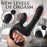 A hand holds a black curved adult novelty massager with a textured shaft and dual suction-style openings. The image includes marketing text reading 'NEW LEVELS OF ORGASM,' circular insets showing vibration and thrusting patterns, and the Master M Series logo.