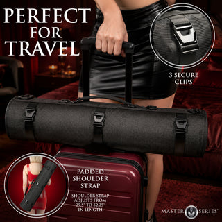 A black Master Series padded travel shoulder strap bag shown being carried over a red suitcase in a dimly lit interior. The image includes text callouts reading 'PERFECT FOR TRAVEL,' '3 SECURE CLIPS,' and 'PADDED SHOULDER STRAP' with adjustment details, plus the Master Series logo.