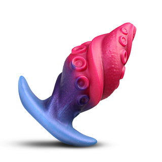 A novelty silicone toy with a spiral body featuring a pink and purple gradient, textured with suction cup details, and a curved blue base, shown on a white background.