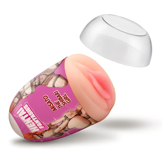 An adult novelty product shown on a clean white background, featuring a flesh-toned silicone insert inside a pink cylindrical container with printed anime-style graphics and text, plus a clear dome lid floating above.
