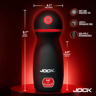 Jock male masturbator device in matte black with red accents, shown on a dark red background with dimension callouts and feature icons. The device has the Jock brand name printed on it.