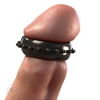Gummy Cock and Head Ring worn on male model, black flexible ring with textured bumps designed for enhanced sensation and snug fit