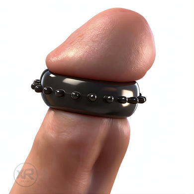 Gummy Cock and Head Ring worn on male model, black flexible ring with textured bumps designed for enhanced sensation and snug fit