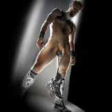 Apex Ball Chute ball parachute worn by a harnessed model in boots, chains hanging from the balls
