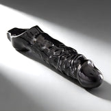 Black cock sheath with pronounced textured shaft and contoured head designed for enhanced stimulation and snug fit