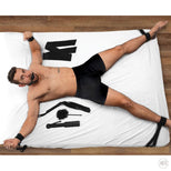 Adjustable bed restraints from the bondage kit strapped to a mattress with velcro cuffs