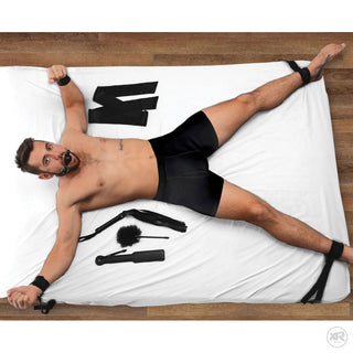 Adjustable bed restraints from the bondage kit strapped to a mattress with velcro cuffs