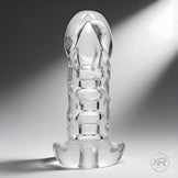 Clear Versatile Cock Sleeve displayed upright, transparent material with molded texture and flared base for stability and ease of use