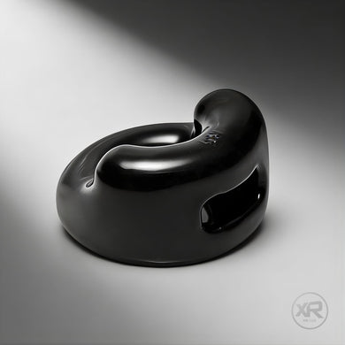 The Cock Holster Cock and Ball Ring in black, sleek molded design with integrated support and smooth finish for comfortable fit