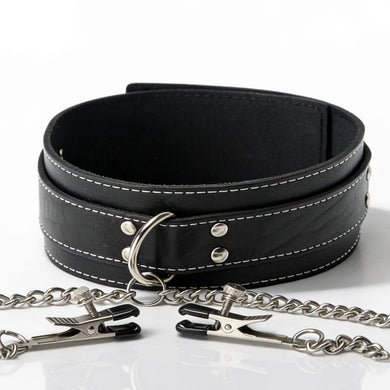 Close-up of a black bondage collar featuring decorative stitching, metal O-ring, chain attachment, and adjustable nipple clamps