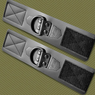 Leather Ankle Cuffs pair laid flat with D-rings and Velcro closures, olive background, Fort Troff