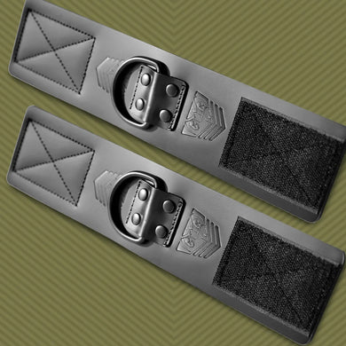 Leather Ankle Cuffs pair laid flat with D-rings and Velcro closures, olive background, Fort Troff