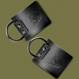 Leather Ankle Cuffs restraints close-up of embossed Fort Troff shield and riveted D-ring
