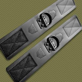Leather Ankle Cuffs bondage restraints pair angled on olive background, showing full strap length, Fort Troff