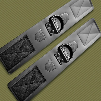 Leather Ankle Cuffs bondage restraints pair angled on olive background, showing full strap length, Fort Troff