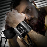 Leather Wrist Cuffs with steel D-rings and carabiner chain on a bearded model, Fort Troff