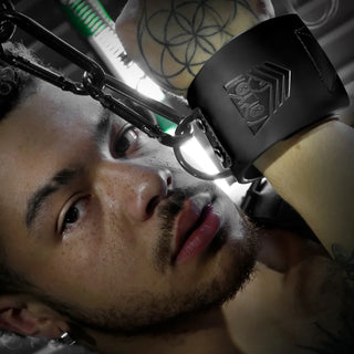 Leather Wrist Cuff clipped to steel chain above a model's face, Fort Troff