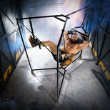 Model lying back in the Hammock Hangar Velvet Guard sling with his boots in the padded stirrups