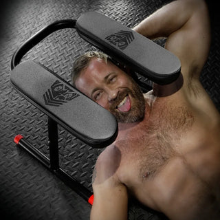 Ready Rimmer padded rim seat over a grinning bearded man lying underneath, Fort Troff