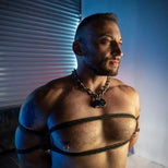 Grunt Rope chest harness tie on a bearded model in a chain collar