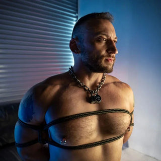 Grunt Rope chest harness tie on a bearded model in a chain collar