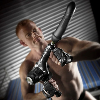 Gunner System handheld mode, model gripping the machine with dildo attached