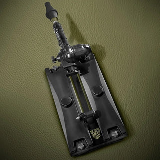 Gunner System ballast base with the machine mounted, top-down view of the rail and knobs