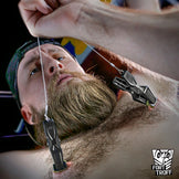 Hardwire Hangers steel cord pulled tight above a bearded model lying on his back