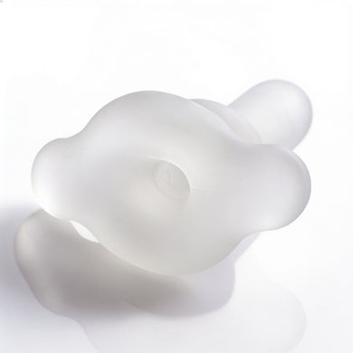 Top view of the Inception Multi-Functional Sex Sleeve showcasing the rounded stretch ring and centered opening in a soft translucent finish