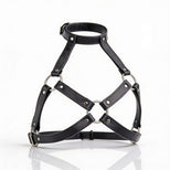 Black leather harness bra with adjustable neck strap, silver O-rings, and open geometric cup design displayed on white background