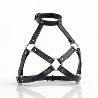 Black leather harness bra with adjustable neck strap, silver O-rings, and open geometric cup design displayed on white background