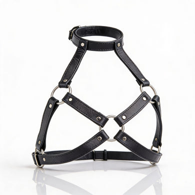 Black leather harness bra with adjustable neck strap, silver O-rings, and open geometric cup design displayed on white background