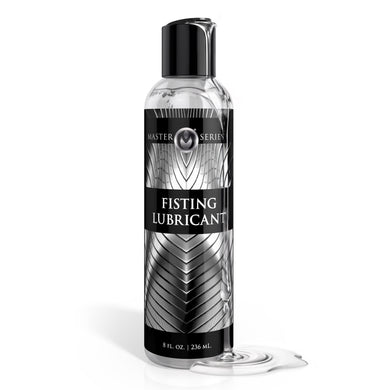 Master Series fisting lubricant bottle with clear water based lubricant spill on white background