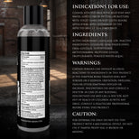 Bottle of a skincare product with its label on a dark background