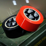 Mega-Roll bondage tape in red and black, 164 foot rolls with the Fort Troff shield