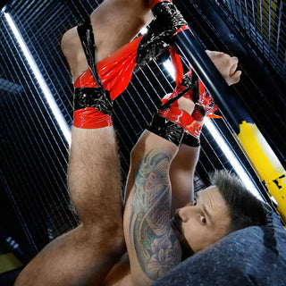 Mega-Roll bondage tape wrapped around cock and balls and legs, close-up