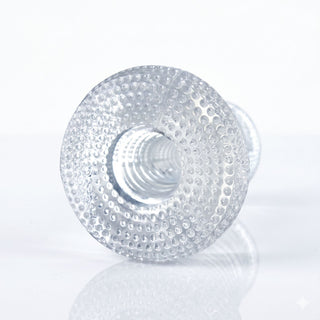 Close-up of the Palm-Tec DX17 Clear Stroker showcasing the ribbed internal canal and textured outer surface for enhanced stimulation