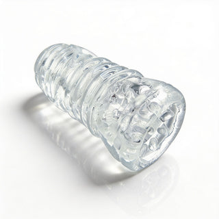 Angled view of the Palm-Tec LX20 Intense Stroker highlighting the transparent material, ribbed outer texture, and ergonomic handheld shape