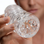 Close-up of the Palm-Tec LX20 Intense Stroker entrance highlighting the transparent material, internal texture nodes, and detailed stimulation features