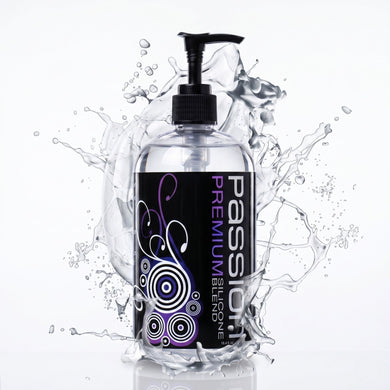 Large bottle of Passion Premium Silicone-Based Lubricant with pump dispenser surrounded by dramatic liquid splash effects highlighting its silky smooth formula