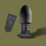 Robo Rimmer Slim vibrating plug upright next to its wireless remote