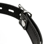 Close-up of adjustable silver buckle hardware and stitched black faux leather strap on silicone ball gag