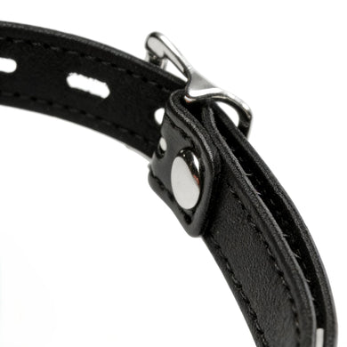 Close-up of adjustable silver buckle hardware and stitched black faux leather strap on silicone ball gag