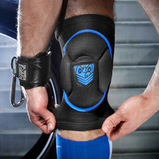 Skullfuck knee pad in blue being pulled on over the knee