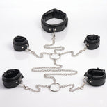 Complete bondage shackle set arranged on a white background with padded collar, four cuffs, metal rings, and detachable chains
