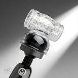 Clear textured sleeve attachment mounted on wand massager head, featuring internal ridges and nubs for enhanced sensation